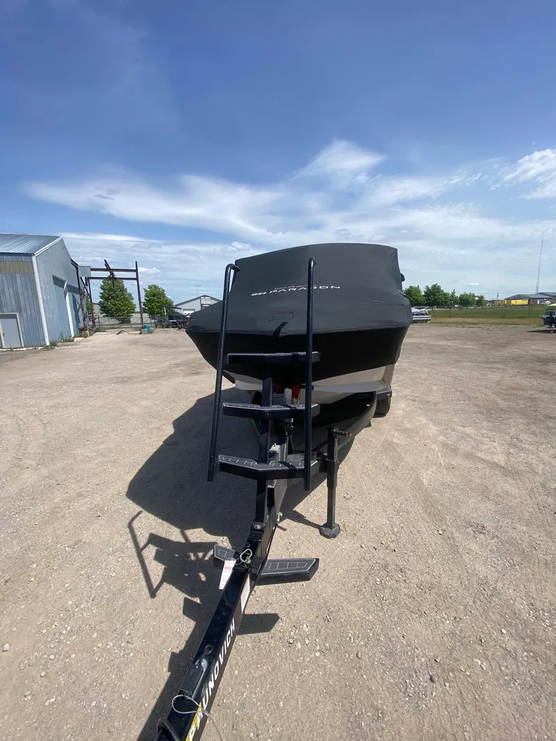 Slide: The Image of 2022 Nautique Super Air Nautique G23 Paragon boat on trailer under clear blue sky. - 31