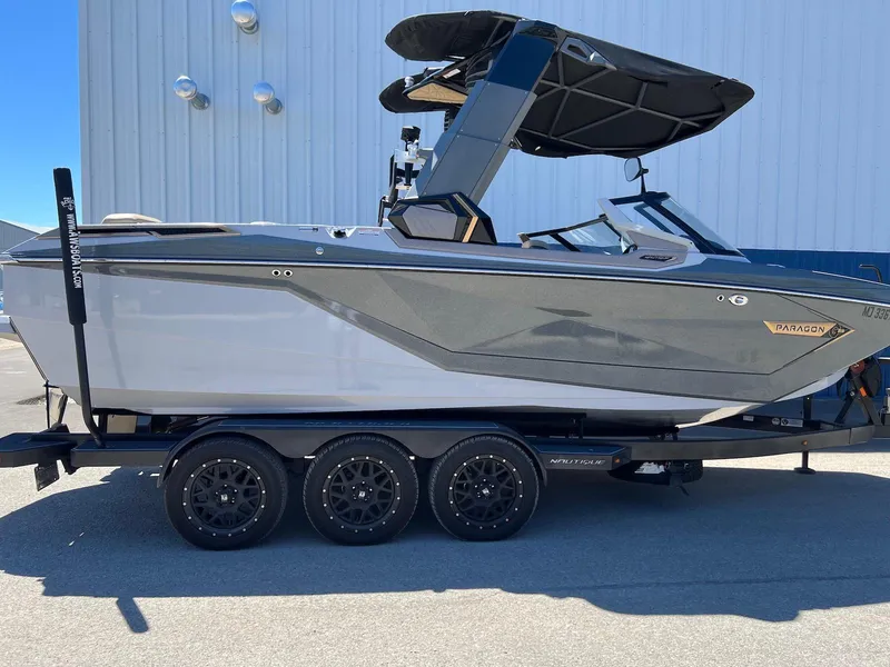 Slide: The Image of 2022 Nautique Super Air Nautique G23 Paragon boat on trailer, side view. - 8