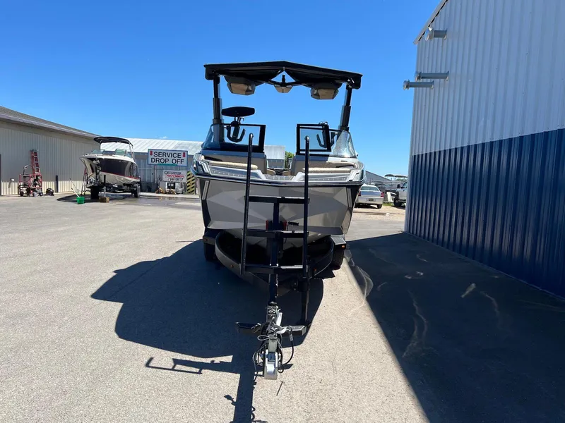 Slide: The Image of 2022 Nautique Super Air Nautique G23 Paragon boat parked outside a service center. - 9