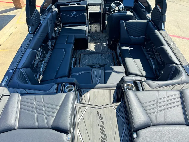 Slide: The Image of 2024 Tigé 23ZX Ultre' boat interior with luxurious seating and modern design. - 10