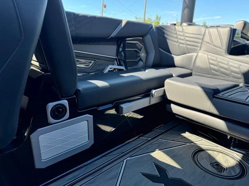 Slide: The Image of 2024 Tigé 23ZX Ultre' interior with luxurious black seating and modern design elements. - 14
