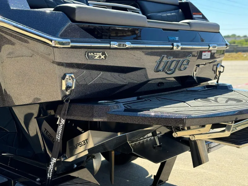 Slide: The Image of 2024 Tigé 23ZX Ultre' boat rear view with TAPS 3T technology. - 7