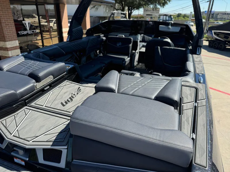Slide: The Image of 2024 Tigé 23ZX Ultre' boat interior with luxurious seating and modern design. - 9