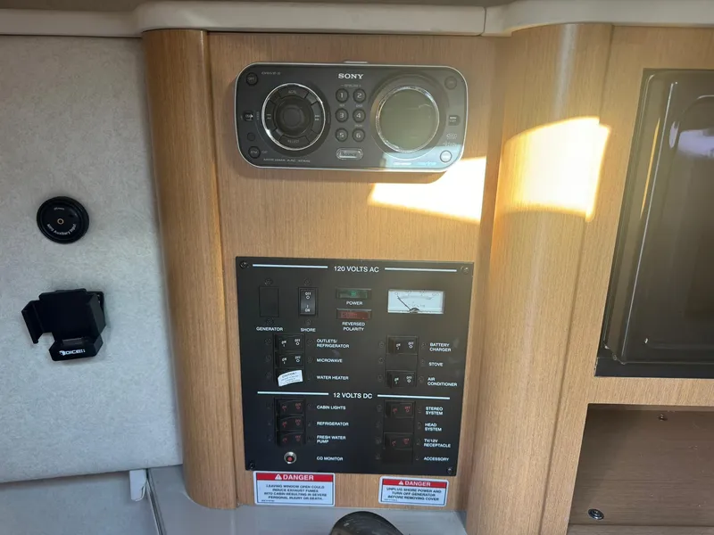 Slide: The Image of Control panel of a 2009 Sea Ray 240 Sundancer boat with Sony audio system. - 19