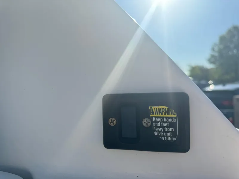 Slide: The Image of Warning label on 2009 Sea Ray 240 Sundancer boat, cautioning against moving parts. - 21