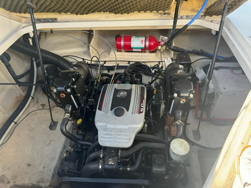 Slide: The Image of Engine compartment of 2009 Sea Ray 240 Sundancer with fire extinguisher and wiring. - 22