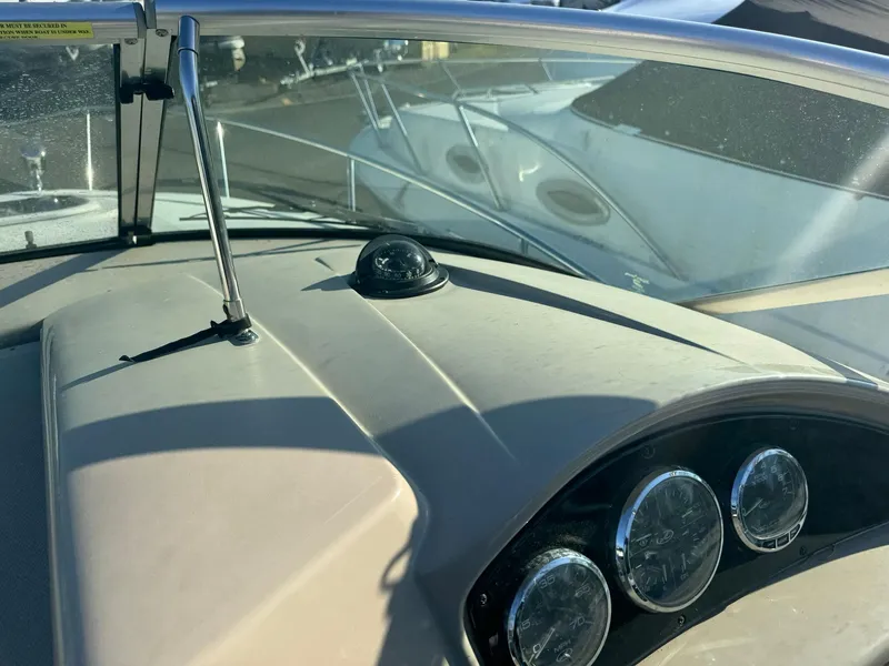Slide: The Image of Dashboard of 2009 Sea Ray 240 Sundancer boat with gauges and compass. - 5