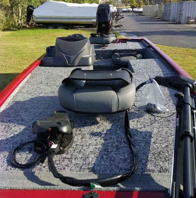 Slide: The Image of 2025 Tracker Pro 170 boat interior with seating and equipment on a sunny day. - 4