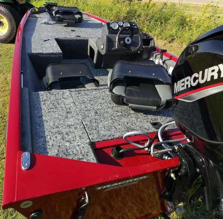 Slide: The Image of 2025 Tracker Pro 170 boat with Mercury engine, red exterior, and spacious interior. - 5