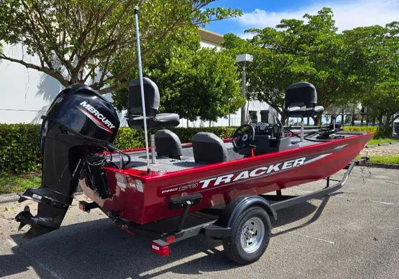 Slide: The Image of 2025 Tracker Pro 170 boat with Mercury engine, parked outdoors. - 3