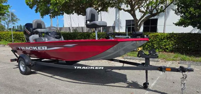 Slide: The Image of 2025 Tracker Pro 170 boat on trailer, red and gray, parked outdoors. - 4