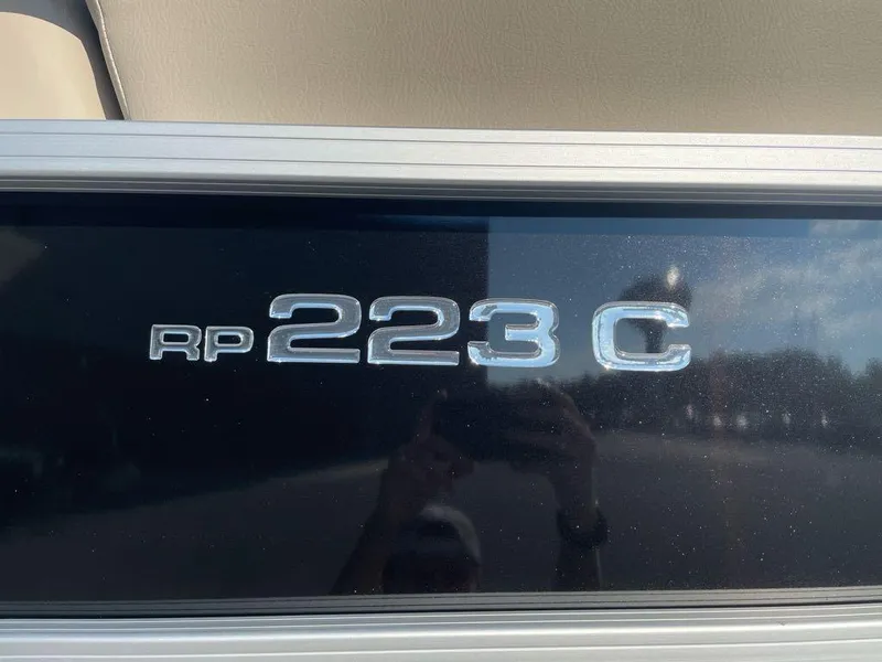 Slide: The Image of 2024 Ranger Reata 223C model emblem on a reflective surface. - 2