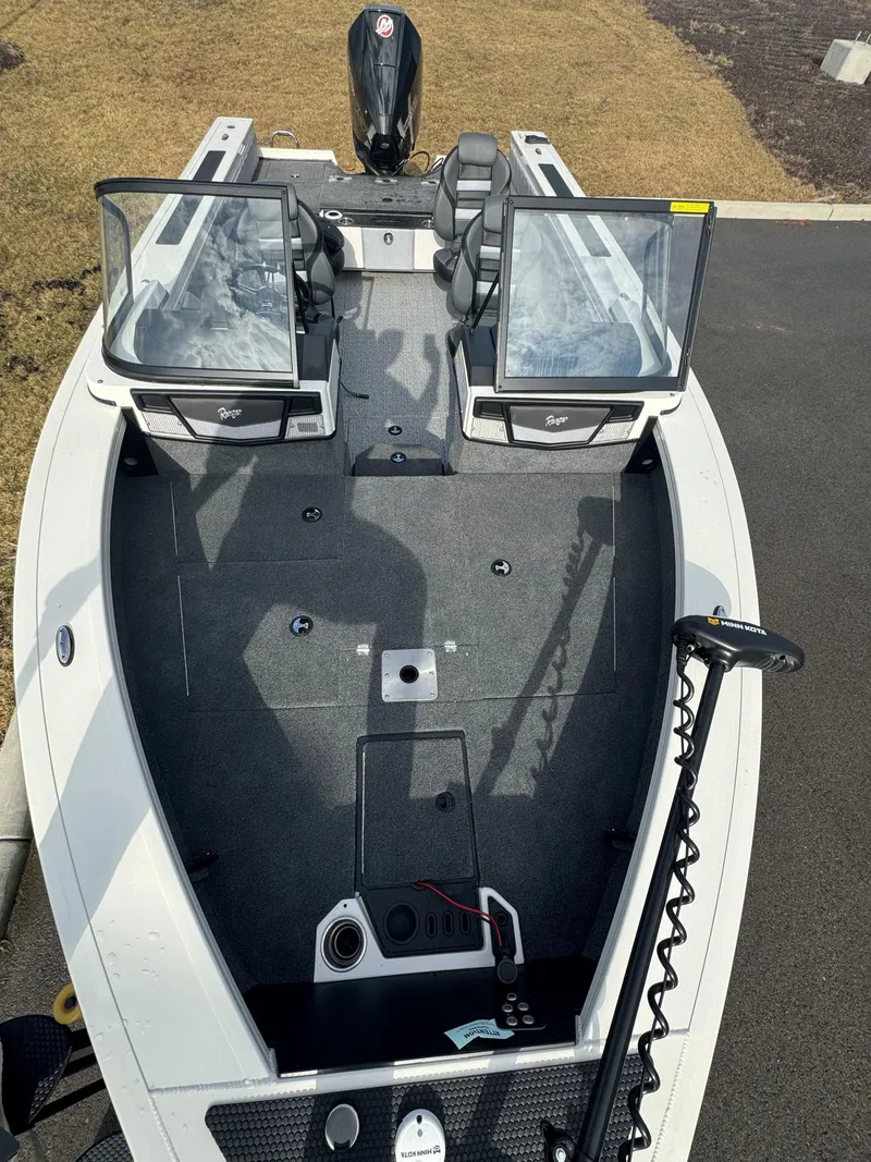 Slide: The Image of 2024 Ranger VX1988 WT fishing boat with open deck and seating. - 3