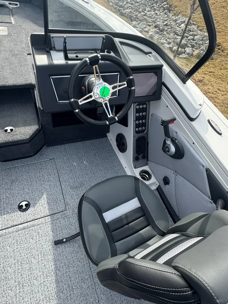 Slide: The Image of 2024 Ranger VX1988 WT boat interior with steering wheel and seating. - 5