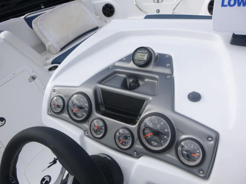 Slide: The Image of Dashboard of 2024 Tahoe 1950 boat with gauges and controls. - 14
