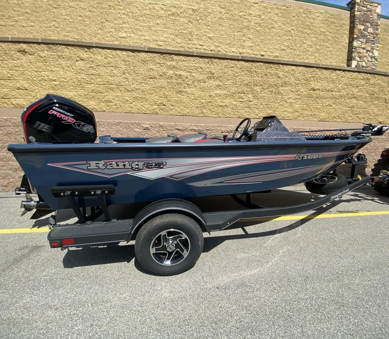 The Image of 2024 Ranger VS1682SC Angler boat on trailer, parked outdoors. - 0