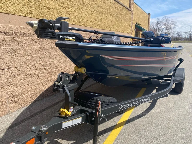 Slide: The Image of 2024 Ranger VS1682SC Angler boat on trailer, featuring Minn Kota trolling motor. - 2