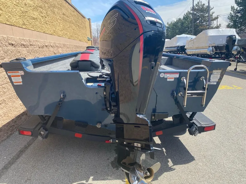 Slide: The Image of 2024 Ranger VS1682SC Angler boat with powerful outboard motor, parked outdoors. - 3