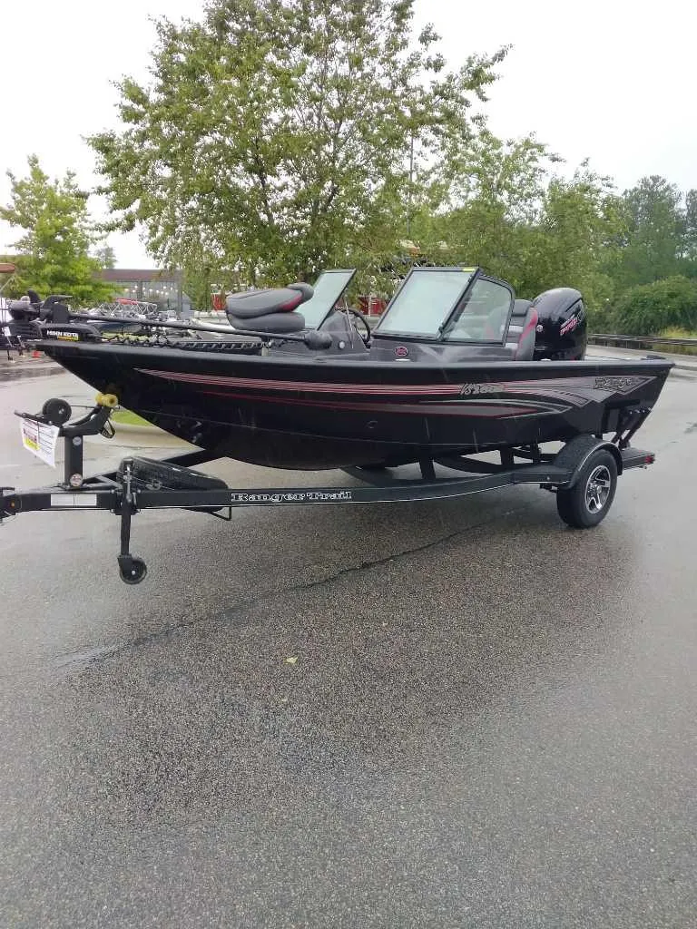 The Image of 2024 Ranger VS1682SC Angler boat on trailer in parking lot. - 0