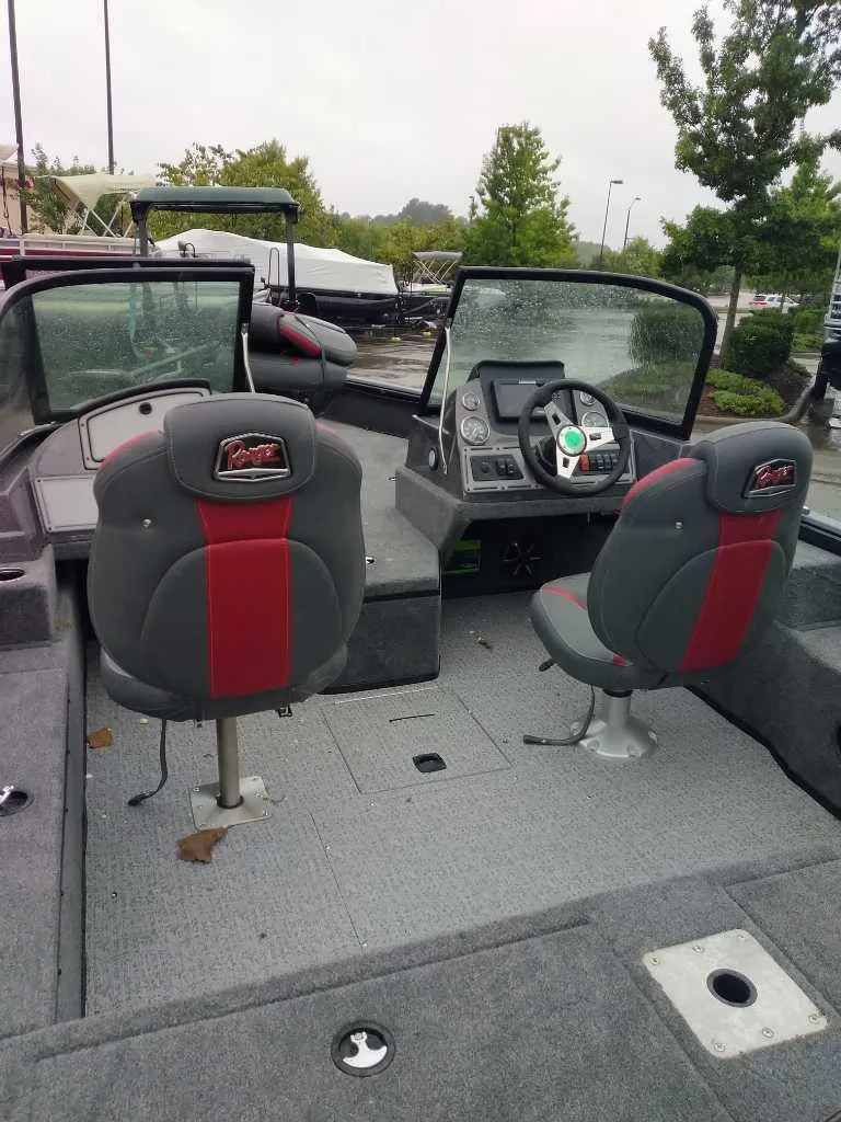 Slide: The Image of 2024 Ranger VS1682SC Angler boat interior with dual seats and control panel. - 2