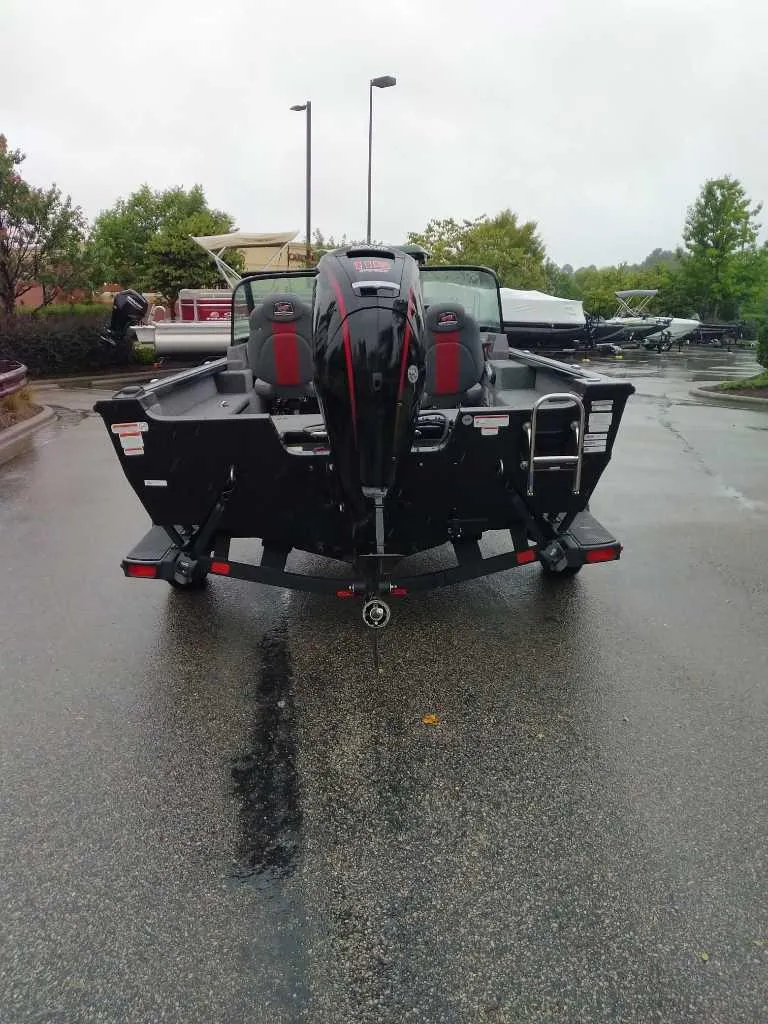 Slide: The Image of 2024 Ranger VS1682SC Angler boat on trailer, rear view, parked outdoors. - 3