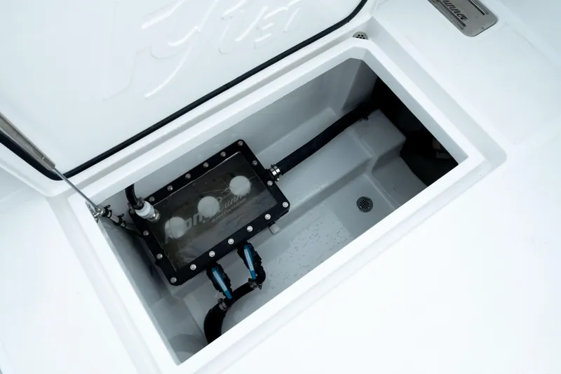 Slide: The Image of 2025 Front Runner 37 Catamaran storage compartment with wiring and drainage system. - 10