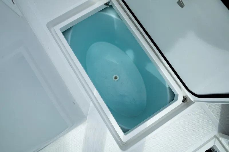 Slide: The Image of Livewell compartment on 2025 Front Runner 37 Catamaran, open lid view. - 18