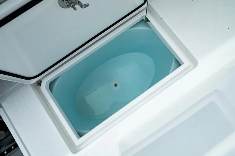 Slide: The Image of Livewell on 2025 Front Runner 37 Catamaran, open lid, filled with water. - 19