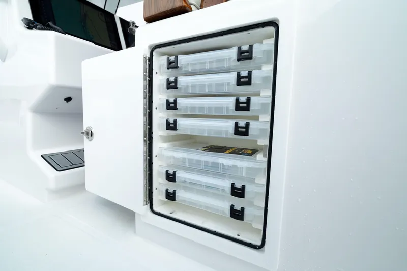 Slide: The Image of Storage compartment with tackle boxes on a 2025 Front Runner 37 Catamaran. - 20