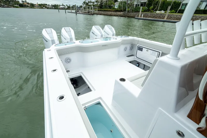 Slide: The Image of 2025 Front Runner 37 Catamaran on water, showcasing spacious deck and multiple outboard engines. - 24