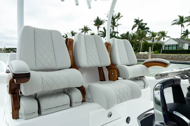 Slide: The Image of Luxurious seating on 2025 Front Runner 37 Catamaran with quilted upholstery and wooden accents. - 3