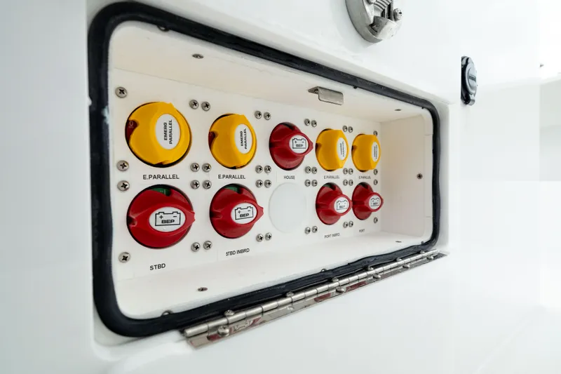 Slide: The Image of Control panel of 2025 Front Runner 37 Catamaran with labeled switches and dials. - 30