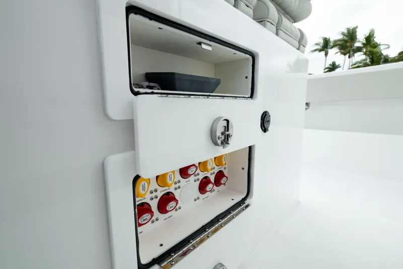 Slide: The Image of 2025 Front Runner 37 Catamaran storage compartments with organized beverage holders. - 31