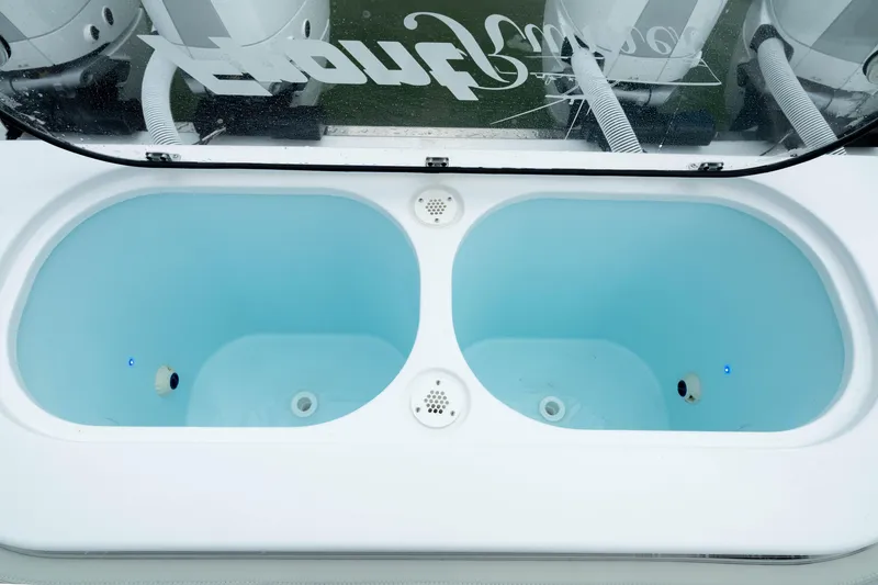 Slide: The Image of Livewell tanks on a 2025 Front Runner 37 Catamaran, featuring dual compartments. - 9