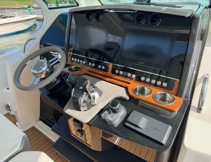Slide: The Image of 2020 Tiara Sport 34 LS helm with dual screens and modern controls. - 14