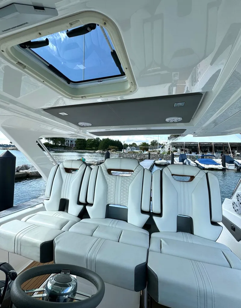 Slide: The Image of Luxurious interior of 2020 Tiara Sport 34 LS boat with plush seating and skylight. - 17