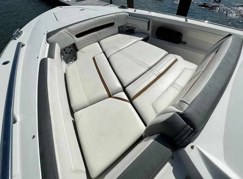 Slide: The Image of 2020 Tiara Sport 34 LS boat with luxurious white seating. - 20