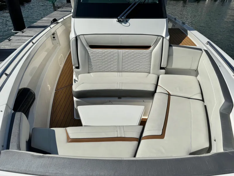 Slide: The Image of 2020 Tiara Sport 34 LS boat with luxurious seating and teak flooring. - 21