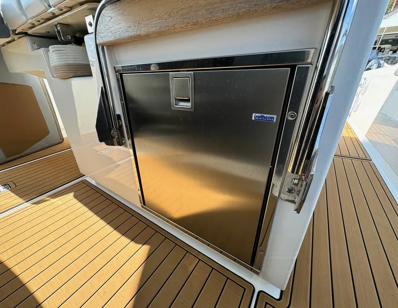 Slide: The Image of Stainless steel fridge on 2020 Tiara Sport 34 LS boat deck. - 22