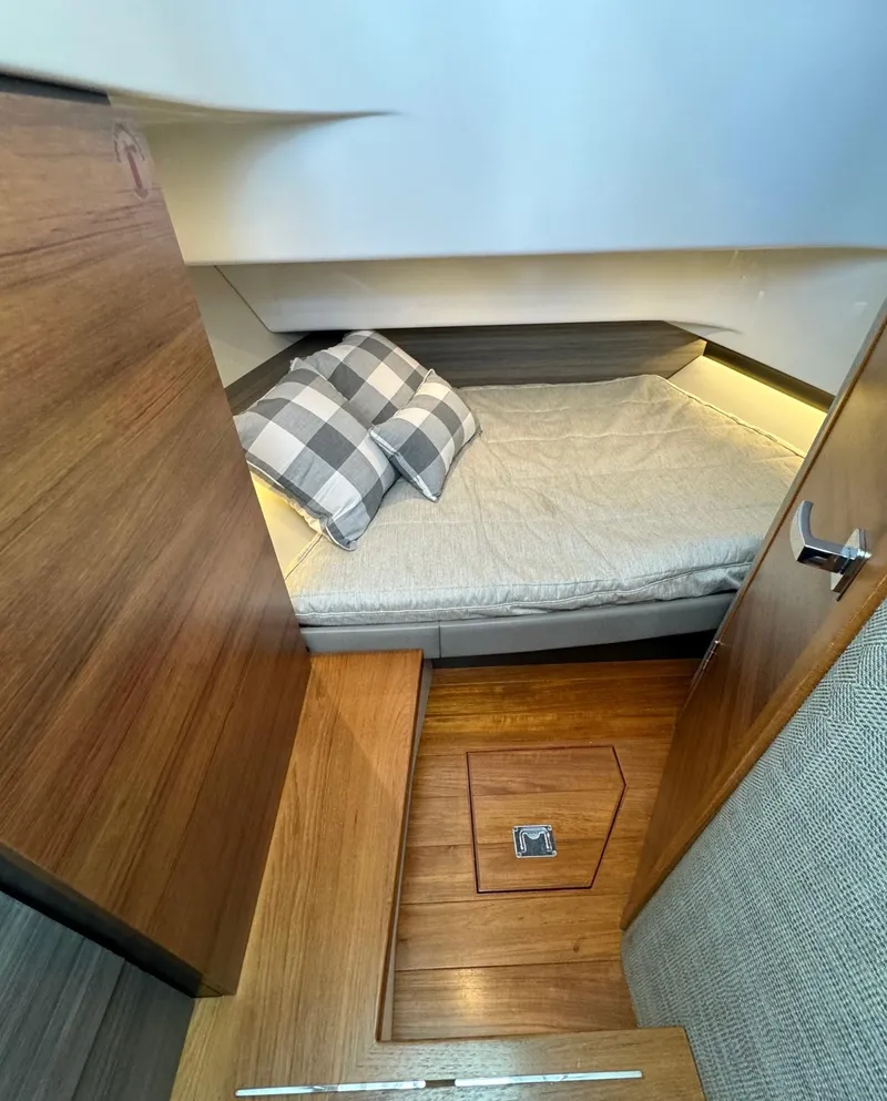 Slide: The Image of 2020 Tiara Sport 34 LS cabin interior with bed and wooden flooring. - 23