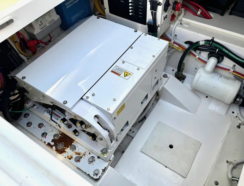 Slide: The Image of Engine compartment of 2020 Tiara Sport 34 LS boat, showing generator and wiring. - 26
