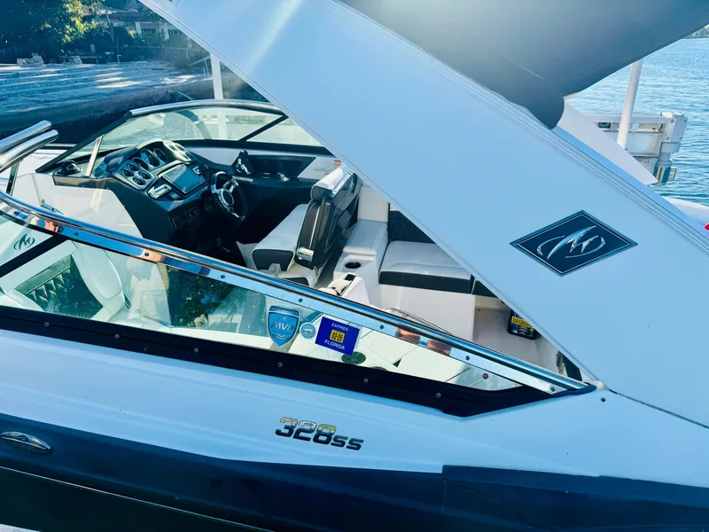 Slide: The Image of 2020 Monterey 328 SS boat interior with sleek design and modern dashboard. - 22
