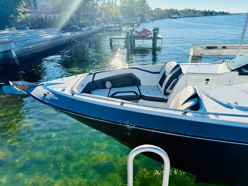 Slide: The Image of 2020 Monterey 328 SS boat docked in clear water, sunny day. - 23