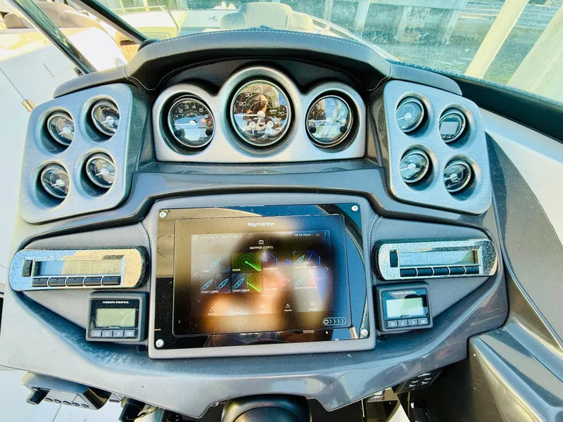 Slide: The Image of Dashboard of a 2020 Monterey 328 SS boat with gauges and touchscreen display. - 24