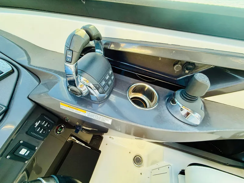 Slide: The Image of 2020 Monterey 328 SS boat controls with joystick and throttle. - 28
