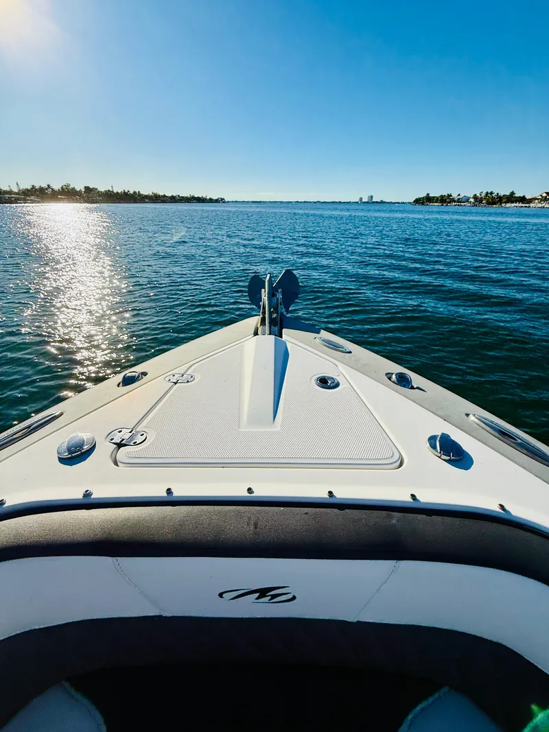 Slide: The Image of 2020 Monterey 328 SS boat cruising on a sunny, calm sea. - 36