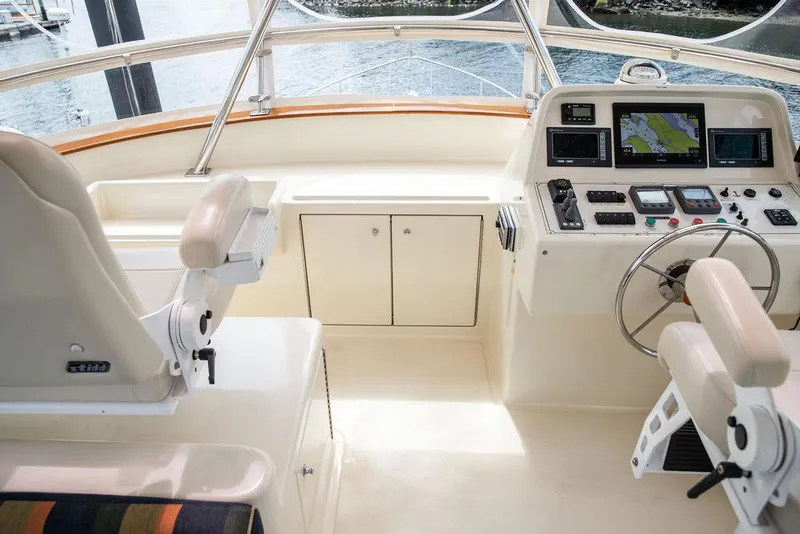 Slide: The Image of Control panel of 2007 Vicem 54 Classic Flybridge yacht with navigation screens and controls. - 15