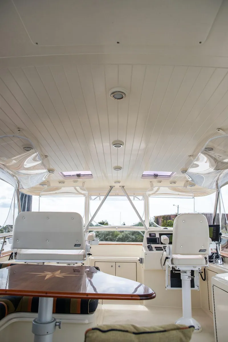 Slide: The Image of Control panel of a 2007 Vicem 54 Classic Flybridge yacht with joysticks and gauges. - 16