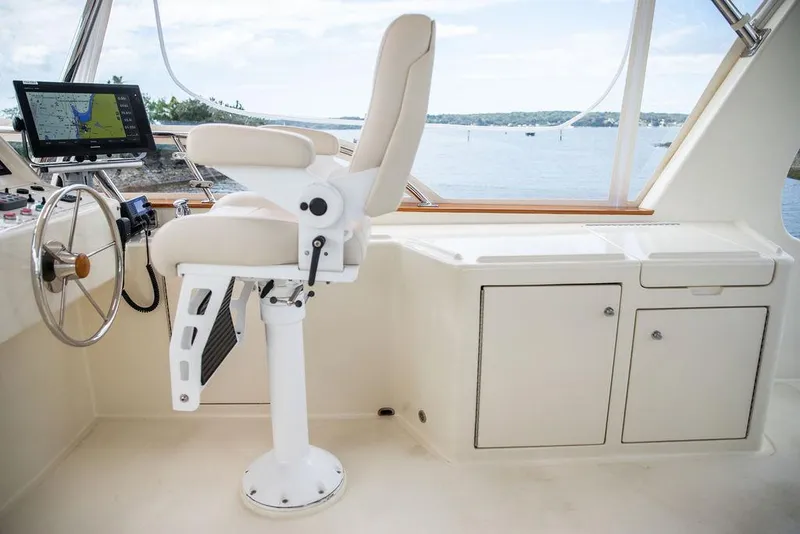 Slide: The Image of Interior view of 2007 Vicem 54 Classic Flybridge yacht with captain at helm. - 17