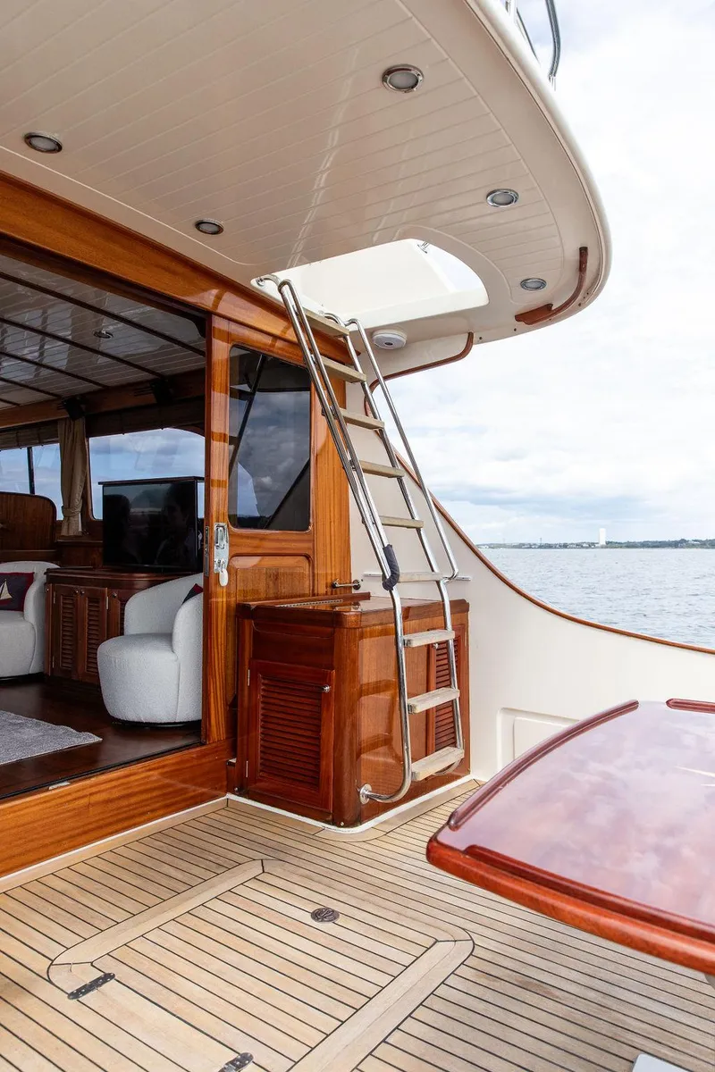 Slide: The Image of Vicem 54 Classic Flybridge 2007 yacht interior with polished wood and chrome handle detail. - 31